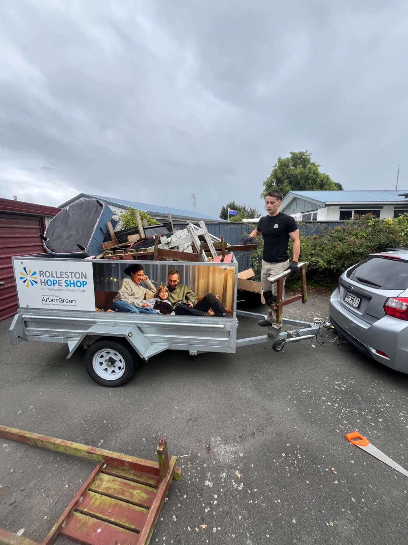 Ryan loading furniture into the trailer on a Rolleston job